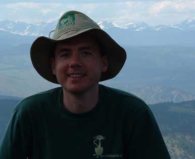Photo of John Hunter on Mesa Trail with the Rocky Mountains in the background, 2003